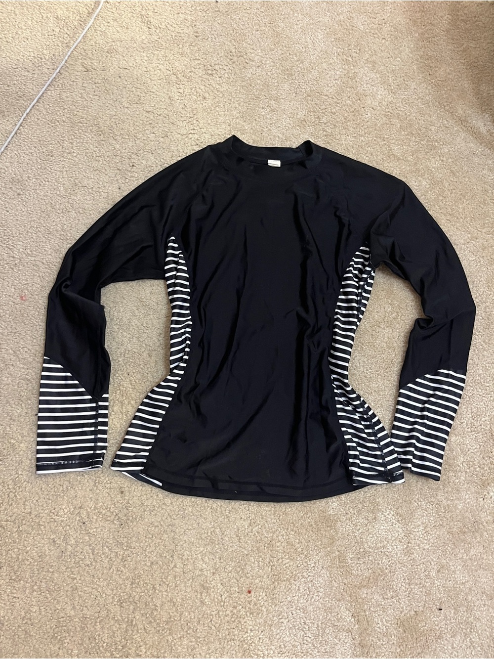 Women’s Black rash guard with white stripe accents